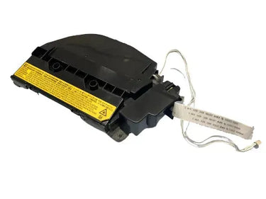 A black car airbag module with a yellow warning label and attached wiring harness is displayed on a white background, similar to the meticulous re-conditioning done by Copier World for the kyocera 2040 laser unit.